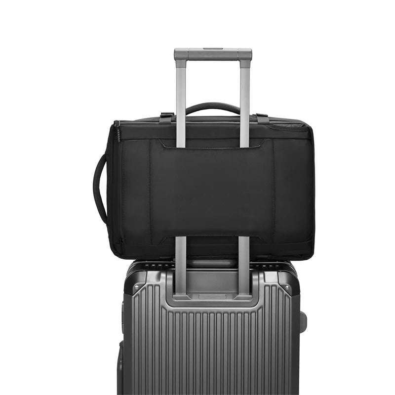 Safe & Save Bag™ on top of a gray suitcase, showcasing its travel-friendly design and convenience.